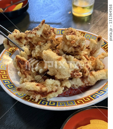Tangsuyuk, a Korean-Chinese dish featuring crispy, deep-fried pork or beef pieces, served with a sweet and sour sauce made from vinegar, sugar, and fruit. A perfect balance of tangy and savory flavors 131364568
