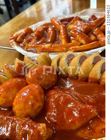 Bunsik, a popular Korean street food, features comforting and savory dishes like tteokbokki (spicy rice cakes), odeng (fish cake skewers), and kimbap (seaweed rice rolls). Perfect for quick meals. Bunsik, a popular Korean street food, features comforting and savory dishes like tteokbokki (spicy rice cakes), odeng (fish cake skewers), and kimbap (seaweed rice rolls). Perfect for quick meals. 131364615