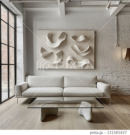 White couch and coffee table sit in front of a white wall White couch and coffee table sit in front of a white wall 131365837