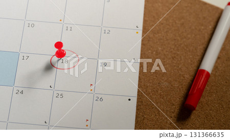 Calendar with the 18th circled in red and a red push pin marking the date, representing time management Calendar with the 18th circled in red and a red push pin marking the date, representing time management 131366635