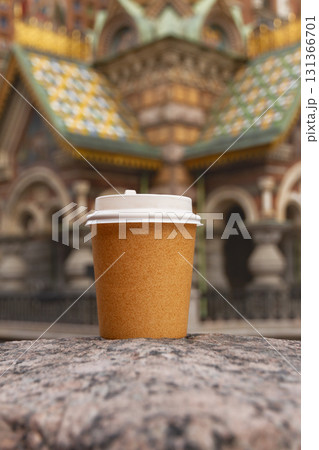 paper cup of drink on bridge in St. Petersburg, Russia on sunny day paper cup of drink on bridge in St. Petersburg, Russia on sunny day 131366701