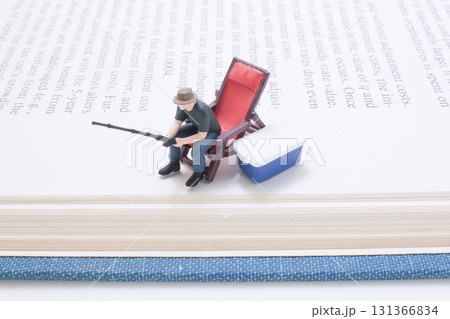 Tiny Model Hunter With Rifle Beside Blue Cooler Tiny Model Hunter With Rifle Beside Blue Cooler 131366834