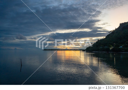 Sunset over the tranquil lagoon of Maupiti, French Polynesia 131367700