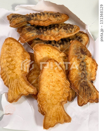 Bungeoppang, bungeo-ppang (Korean Fish Shaped Pastry), popular snack, cookies, sweet in winter streets of Korea. Bungeoppang - Korean traditional national food, dish, cuisine. Japanese taiyaki Bungeoppang, bungeo-ppang (Korean Fish Shaped Pastry), popular snack, cookies, sweet in winter streets of Korea. Bungeoppang - Korean traditional national food, dish, cuisine. Japanese taiyaki 131368129