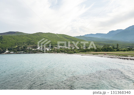 Village beach view Roadtrip Winding road along rocky coast of Cap Corse peninsula on Corsica island France 131368340