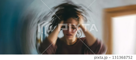 Woman stress anxiety headache blurred motion indoor emotional frustration pain 131368752
