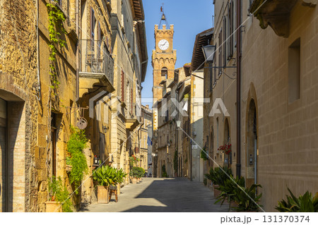 Pienza street scene historical town bell tower Tuscany 131370374