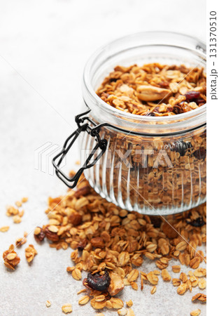 Granola cereal in glass jar for healthy breakfast 131370510