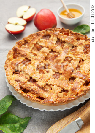 Delicious homemade apple pie with honey and coffee enjoyed during autumn season 131370518