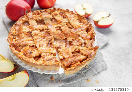 Apple pie with lattice crust and fresh apples Apple pie with lattice crust and fresh apples 131370519