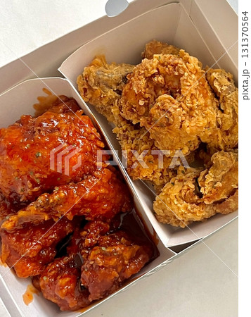 Crispy fried chicken with golden, crunchy skin and juicy, tender meat. A delicious and savory dish, perfect for any meal, served with dipping sauces or side dishes for extra flavor! 131370564