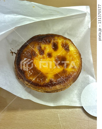 Golden egg tart with a flaky, buttery crust and a rich, creamy custard center. A deliciously satisfying treat for dessert or a light snack, blending texture and flavor perfectly. Golden egg tart with a flaky, buttery crust and a rich, creamy custard center. A deliciously satisfying treat for dessert or a light snack, blending texture and flavor perfectly. 131370577