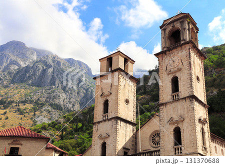 Famous landmark - Church of Saint Tryphon in old town Kotor, Montenegro. Picturesque view of medieval cathedral against backdrop of high mountains. Topic of summer vacation, travel, cruises and tours 131370688