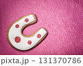Horseshoe cookies on the wooden grunge pink background 131370786