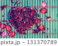 Heart  from paper on dry Hibiscus flowers. Natural background. Health concept 131370789