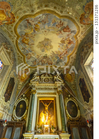 Ornate altar and frescoed ceiling in historic Italian monastery 131371286