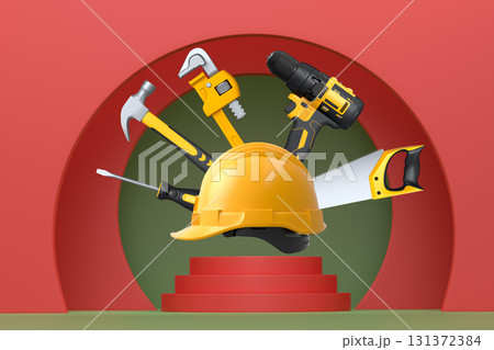 Construction tools and safety equipment floating over podium on abstract background, industrial work and protection concept 131372384