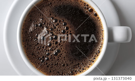 Overhead view of coffee in a white cup. AI-generated item 131373040