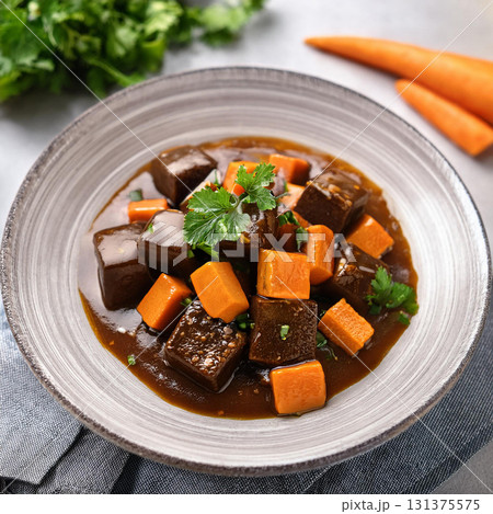 Black Bean Curd Served with Carrot Sauce Black Bean Curd Served with Carrot Sauce 131375575