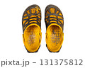 paint stained and heavily worn yellow black sandals. top view 131375812