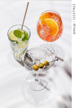 A vibrant display of cocktails, including Aperol Spritz, Mojito, and Martini 131377621