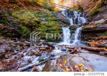 beautiful autumn landscape with waterfall shypit. popular destination in carpathian mountains of ukraine. forest in golden leaves. amazing sunny weather during fall season beautiful autumn landscape with waterfall shypit. popular destination in carpathian mountains of ukraine. forest in golden leaves. amazing sunny weather during fall season 131377716