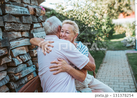 Happy senior couple embracing, spending time together during retirement. 131378254