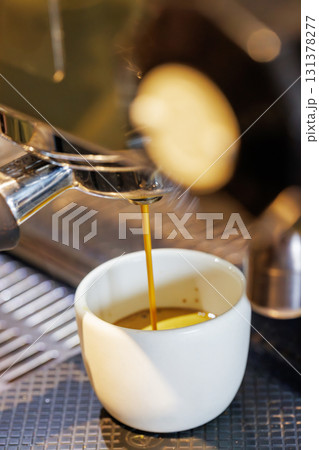 Coffee machine pouring fresh espresso into a cup Coffee machine pouring fresh espresso into a cup 131378277