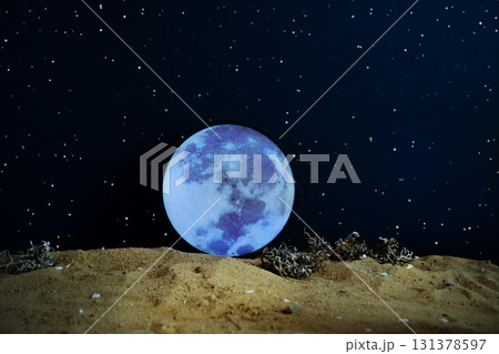 Majestic giant Moon rising above alien planet surface under sparkling starry sky, symbol of cosmic and interplanetary exploration. Night scene of glowing Moon seen from distant planet surface. Majestic giant Moon rising above alien planet surface under sparkling starry sky, symbol of cosmic and interplanetary exploration. Night scene of glowing Moon seen from distant planet surface. 131378597
