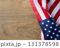 American flag on wooden background, perfect for Memorial Day posters, Veterans Day banners, and patriotic holiday designs with copy space. 131378598