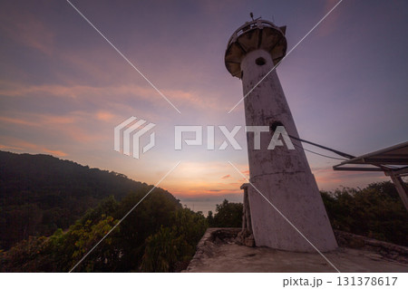 Lighthouse at Sunset with Vibrant Sky Lighthouse at Sunset with Vibrant Sky 131378617