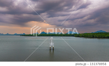 Aerial view of lighthouse in cloudy sky Aerial view of lighthouse in cloudy sky 131378958