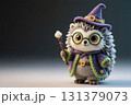 Cute little crocheted hedgehog doll dressed in a witch's costume holding wand in hand. 131379073