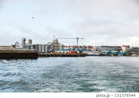 Reykjavik, Iceland, a bustling harbor scene showing a calm waterfront Reykjavik, Iceland, a bustling harbor scene showing a calm waterfront 131379344