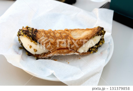 Sweet cannoli pastry with ricotta filling 131379858