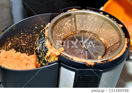 A view of a juicer without a top cover. A view of a juicer without a top cover. 131380598