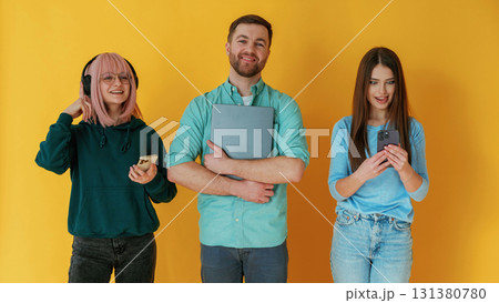 Front view. Group of friends are in the studio against background 131380780