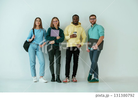 Against white background. Group of friends are in the studio 131380792