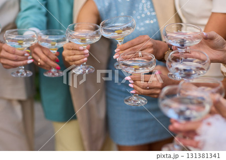 A Celebration Toast featuring beautifully crafted Champagne Glasses filled with bubbly drink A Celebration Toast featuring beautifully crafted Champagne Glasses filled with bubbly drink 131381341