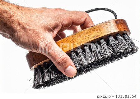 a man with a wire brush a man with a wire brush 131383554