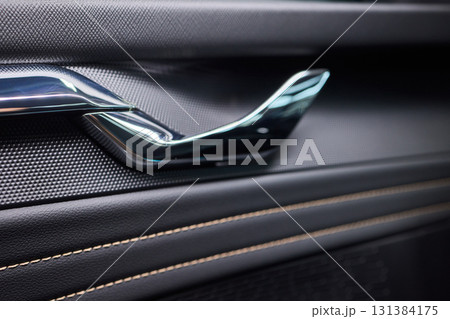 A car door with trim showcasing automotive design details A car door with trim showcasing automotive design details 131384175