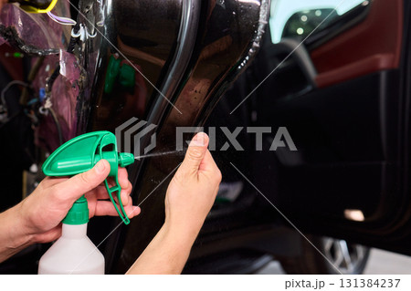 Applying a Protective Film on the Surface of Your Car for Enhanced Durability and Shine Applying a Protective Film on the Surface of Your Car for Enhanced Durability and Shine 131384237