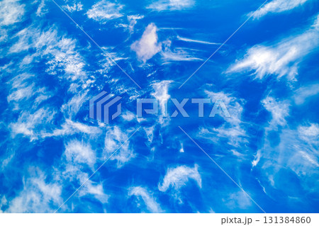 feathery sparse clouds in blue sky feathery sparse clouds in blue sky 131384860