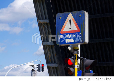 Bridge open for passing ships on Gent Brugge canal in Bruges, Belgium, sunny summer day 131387162