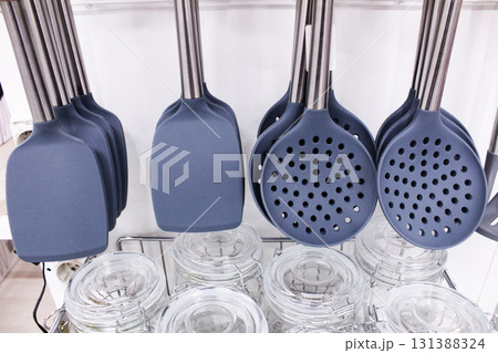 plastic blades and gray slotted spoons close-up. Kitchen Set Accessories plastic blades and gray slotted spoons close-up. Kitchen Set Accessories 131388324