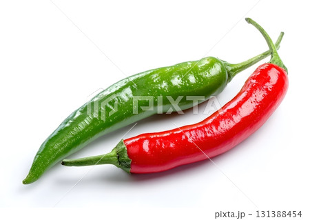 Two chili peppers rest together isolated on a white background. Two chili peppers rest together isolated on a white background. 131388454