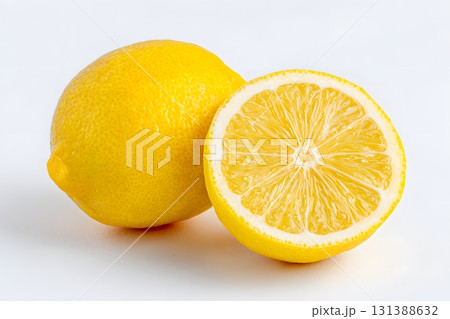 A bright yellow lemon fruit is sliced in half, revealing its juicy interior. A bright yellow lemon fruit is sliced in half, revealing its juicy interior. 131388632