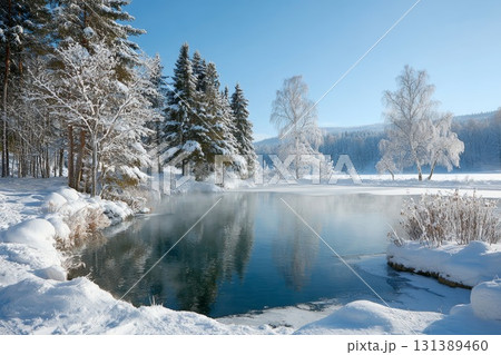 Serene winter landscape with icy water, snow-covered trees, and tranquil reflections in nature Serene winter landscape with icy water, snow-covered trees, and tranquil reflections in nature 131389460