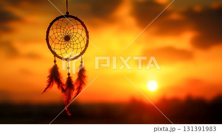 Dreamcatcher Silhouetted Against a Vibrant Sunset in Soft Focus for Serenity and Peace 131391983