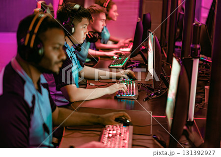 Competitive gamers fully engaged in exciting esports tournaments filled with energy and skill 131392927